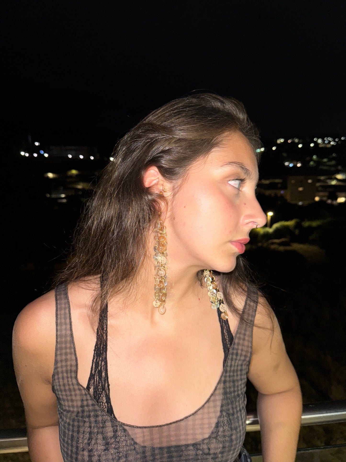 “Profane ground” earrings.