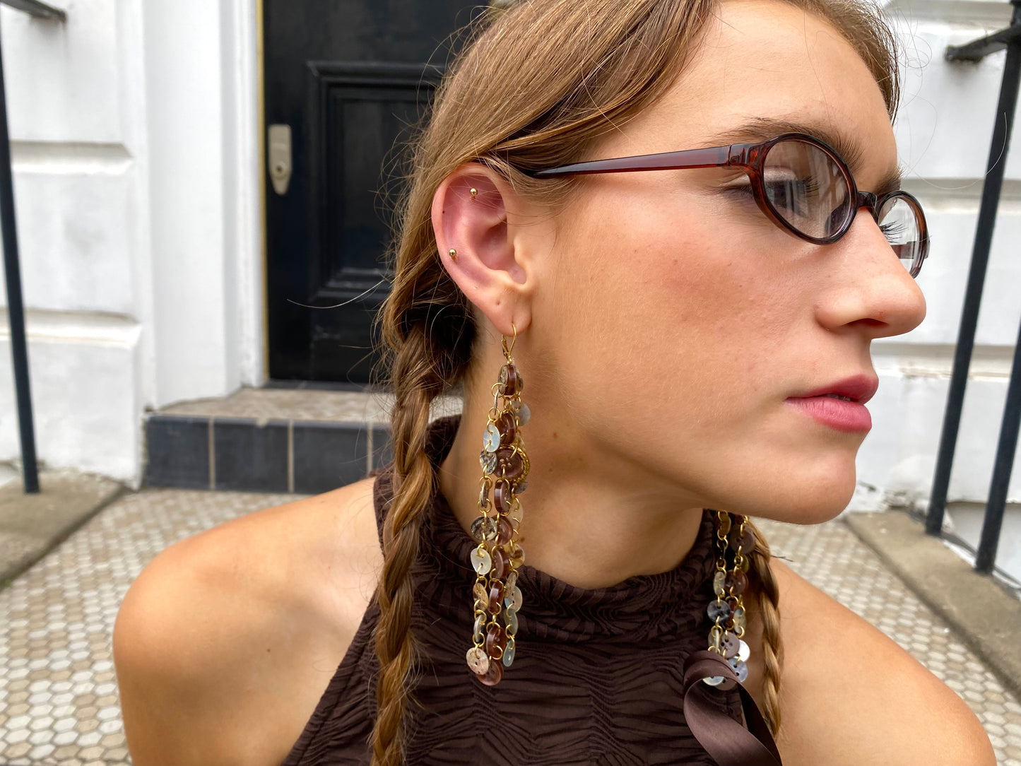 “Profane ground” earrings.