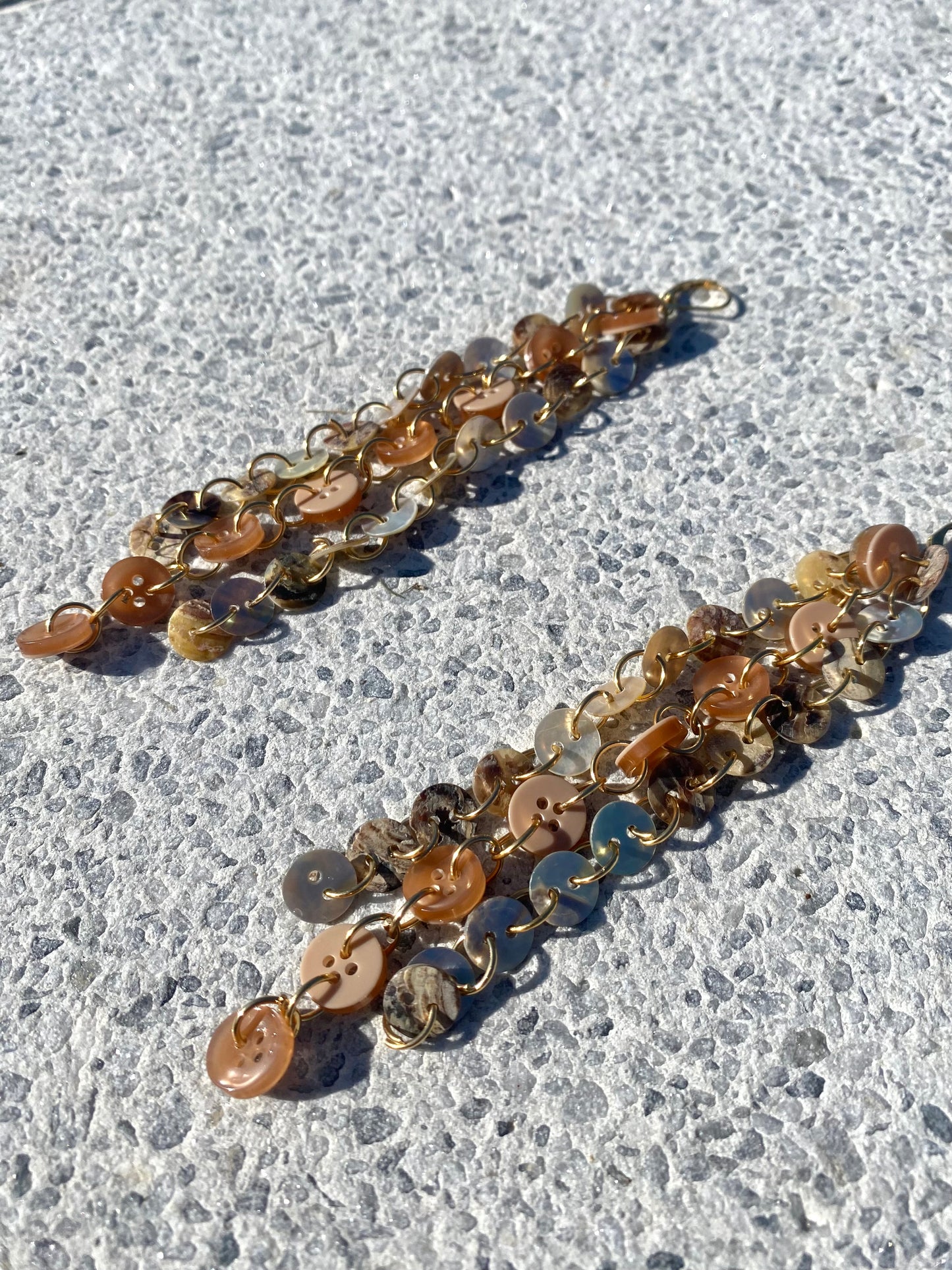 “Profane ground” earrings.